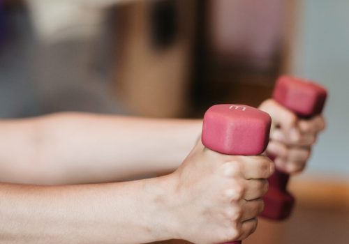 patient with hand weights